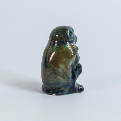 1559 - Bernard Moore seated baby monkey in a rare mushroom and green glaze, height 5cm