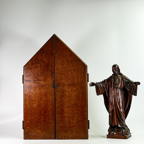 1580 - Large cased wooden figure of Christ, with scrolled inscription of doors 