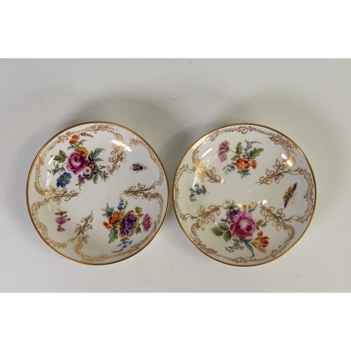 1596 - Pair of Berlin KPM cups and saucers, decorated with flowers and insects. (4)