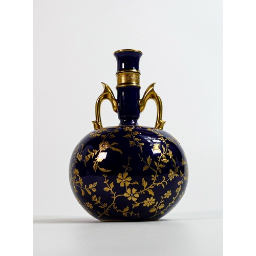 1605 - Mintons aesthetic gilded two handled vase, cobalt blue ground with gilded floral decoration, h16cm.