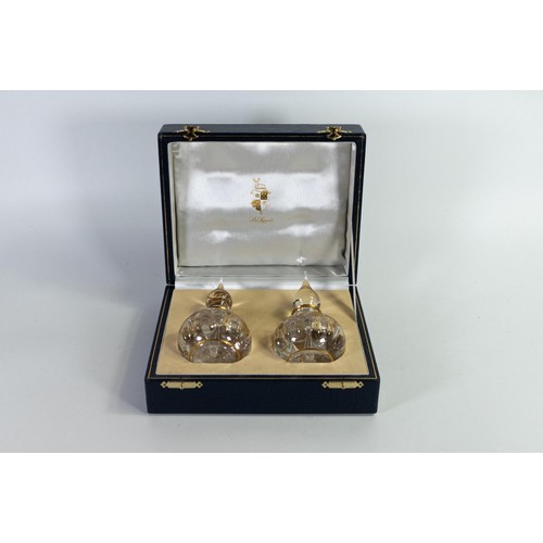 1709 - De Lamerie boxed gilded crystal perfume/scent bottles, height of each 15cm (2)