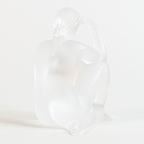 1743 - A Lalique frosted glass kneeling nude figure, etched Lalique, France to base, height 10cm. Boxed