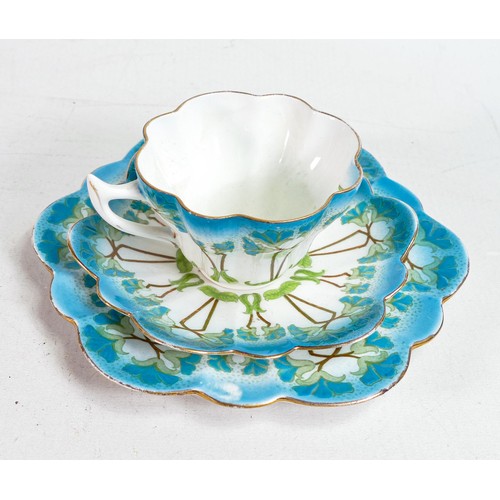 1804 - Foley China, a trio decorated in Art Noveau flower design 7069. Small hairline crack to cup. (3)