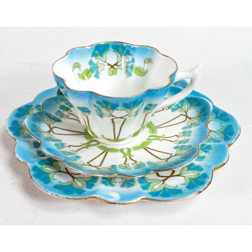 1804 - Foley China, a trio decorated in Art Noveau flower design 7069. Small hairline crack to cup. (3)