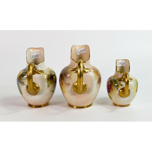 1874 - A graduated set of Royal Worcester gilded ewers, painted with roses, the larger one signed Austin an... 