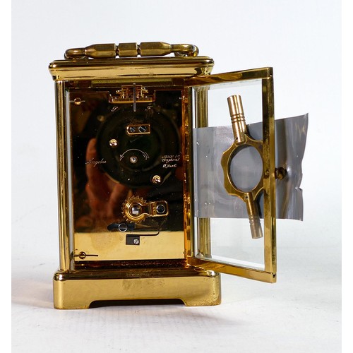 2012 - A 20th century Angelus brass cased carriage clock, the white dial with Roman numerals in black, 17cm... 