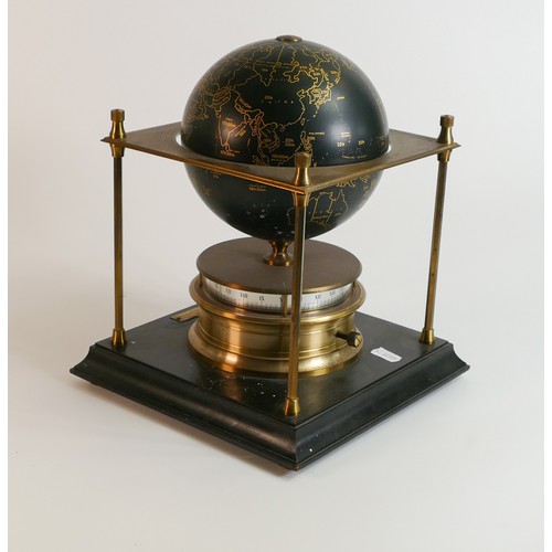 2022 - Royal Geographical Society world clock with gilt and black decoration on a wooden stand.  28cms high... 