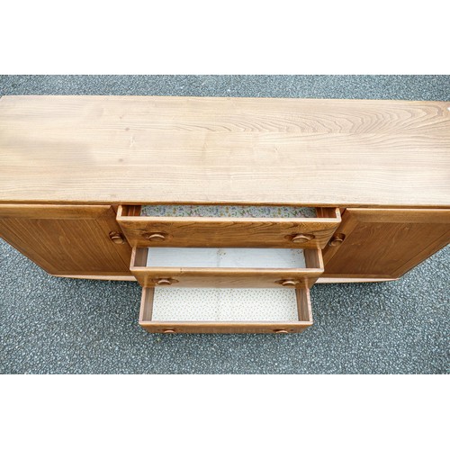 2116 - Late 20th century Light coloured Ercol two door three drawer sideboard, length 156cm, depth 43cm & h... 