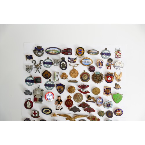 2267 - A collection of early 20th century & later enamel pin badges & similar with varying themes