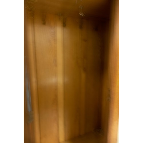 2073 - Oak Arts & Crafts two door wardrobe with mirrored central bevelled edge panel. Mother of pearl inlay... 