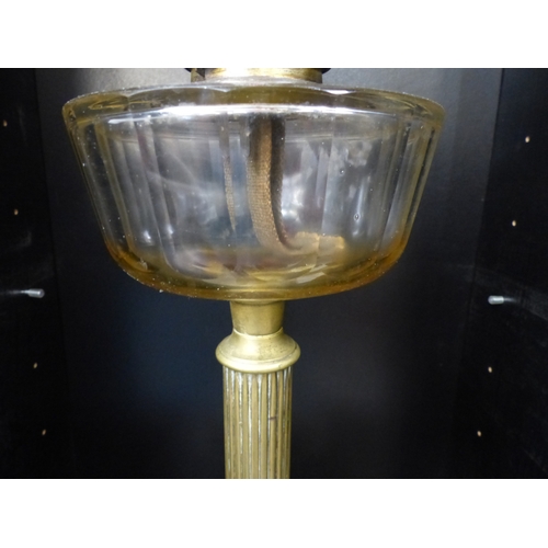 88 - Early 20th Century Glass and Brass Oil Lamp in Collum form. Overall Height Includung Chimney 74cm