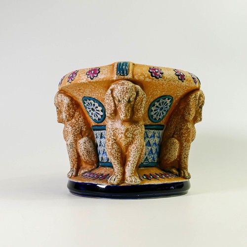 1506 - Amphora Pottery planter decorated with four decorative dog Caryatids.