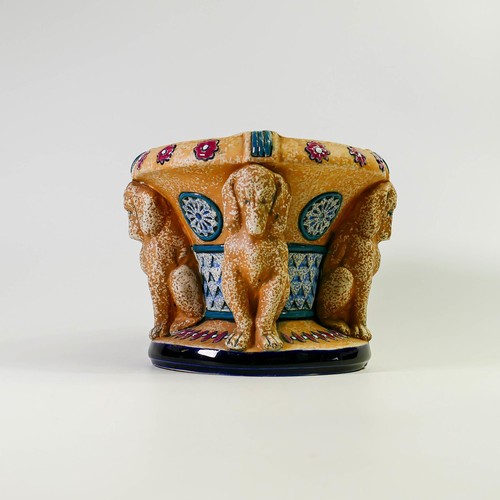 1506 - Amphora Pottery planter decorated with four decorative dog Caryatids.