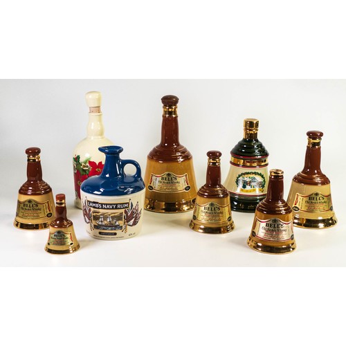 454 - A collection of Wade decanters to include - Bells in various sizes, Christmas 1990 and Lambs Navy ru... 