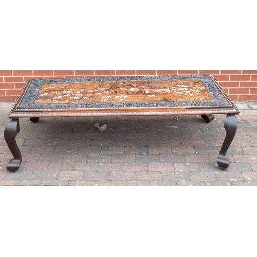 2082 - Large Indian carved coffee table, inlaid with elephants in their natural habitat. Later adapted to a... 