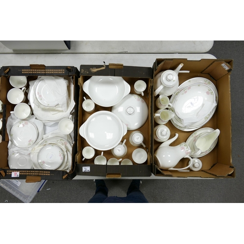 51 - A large collection of Royal Doulton Twilight Rose Patterned Tea & Dinnerware including dinner plates... 