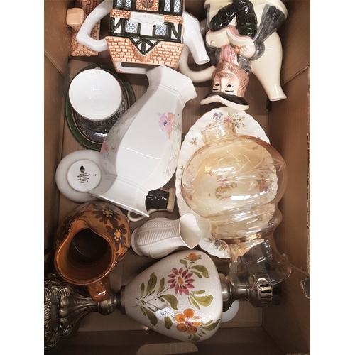 126A - A mixed collection of items to include small Belleek vase, converted oil lamp and shade, novelty tea... 