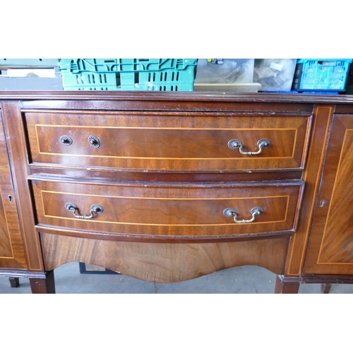 617 - Sheraton Revival Two Drawer Sideboard with inlay banding. Drawers flanked by two cupboards (one hand... 