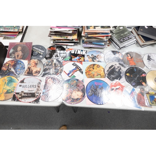 53 - A collection of 1980's & later picture disc records including Rolling Stones, The Killers , Sigsig s... 