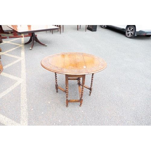 650 - Small Barley Twist Legged Drop Leaf Table with carved top, length 76cm