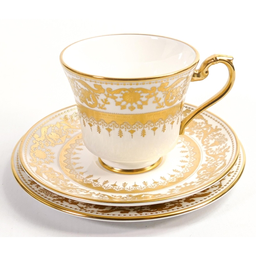 102 - De Lamerie Fine Bone China, heavily gilded Versailles Countess Armorial patterned Trio , specially m... 