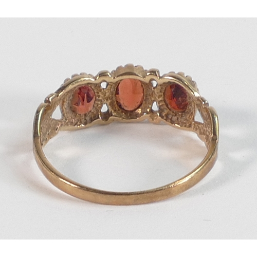 782 - 9ct gold ring set with three light brown stones, size N,2g.