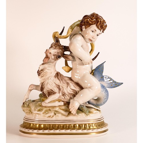 871 - An Algora Porcelain figure, An Allegory to Capricorn. Putti astride a Sea Goat with naturally moulde... 