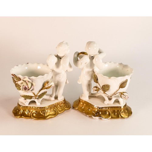 873 - James Shaw & Sons, pair of small vases, with applied naturalistic roses to vase flanked by Putti hol... 