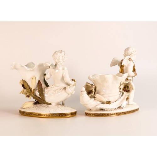 874 - Moore Bros., two small vases, moulded as Cornucopia with figural Putti besides. The body of the vase... 