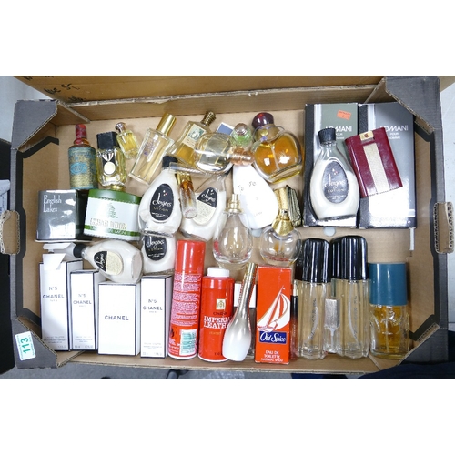 113 - A mixed collection of items to including used perfumes, body lotions etc