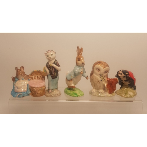 131 - A collection of Beatrix Potter figures to include Beswick Susan, Hunca Munca, Peter Rabbit, Old Mr B... 