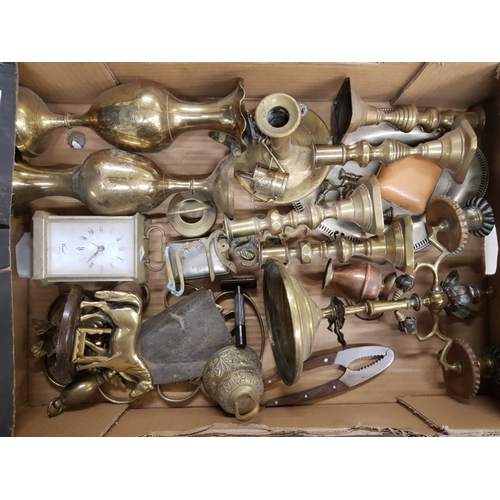 47 - A mixed collection of metal ware items to include brass candelstick holders, indian brass vases etc ... 