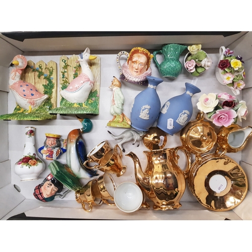 52 - A mixed collection of items to include resin beatrix potter book ends, continental guilt coffeeware ... 