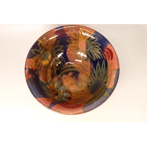 219 - Jonathan Cox Ceramics vibrantly decorated fruit bowl with lustre floral decoration, diameter 28cm