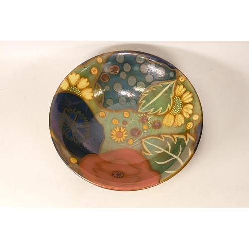 224 - Jonathan Cox Ceramics vibrantly decorated fruit bowl with lustre modernist floral decoration, diamet... 