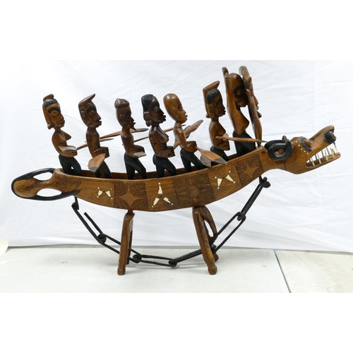 512 - Large Nigerian Inlaid Wooden Carved Boat. An unusually large tribal souvenir work, Seven Men and Wom... 