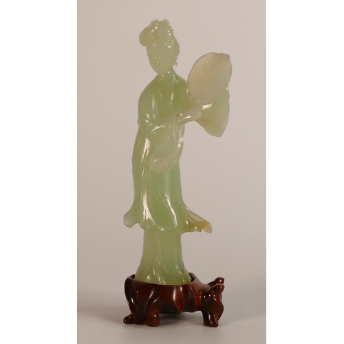 730 - Carved Jade/hardstone model of standing woman on wood base, h.18.5cm.