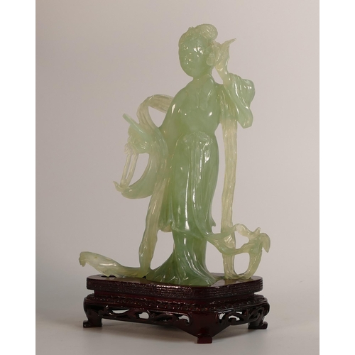 734 - Carved Jade/hardstone model of standing woman on wood base,in original box, h.21cm.