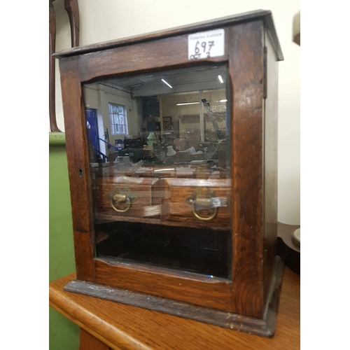 697 - Small Oak smokers cabinet with interior shelving and mixing accessories