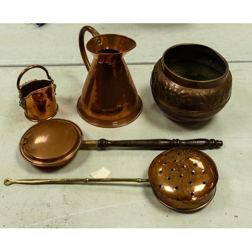 486 - A collection of Copper items to include relief decorated planter, half gallon jug, chestnut toasters... 