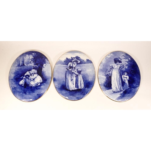 102 - Three Royal Doulton Blue & White Oval Wall Plaques with Child Decoration, each length at largest 24c... 