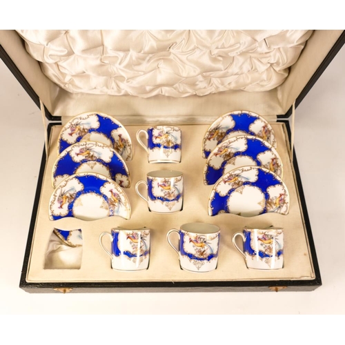 111 - Boxed Continental Part Coffee Set decorated with birds of paradise on panelled ground, missing one c... 