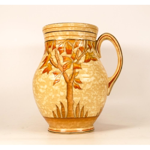 91 - Crown Ducal / Charlotte Rhead jug in the Spanish tree design. Height 25.5cm