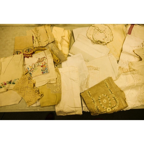 41 - A collection of early 20th Century & later embroidered linen, Table cloths & Lace items