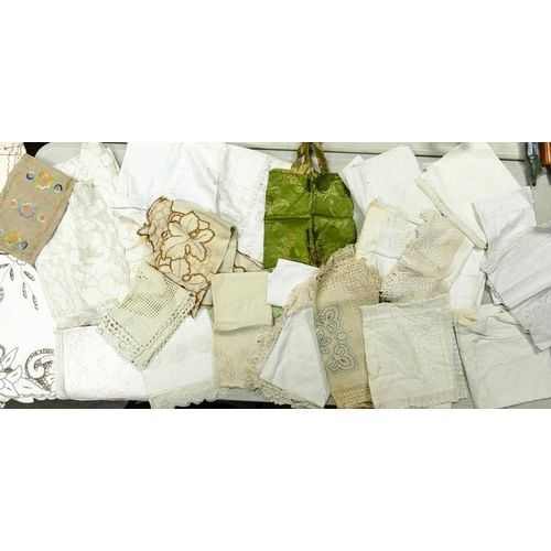 42 - A quantity of lace, linen and embroidered table cloths, napkins, chair backs etc ( 1 tray)