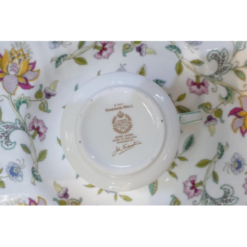 48 - A collection of Minton Haddon Hall pattern dinner & tea ware including rimmed bowls, tureen, tureen ... 