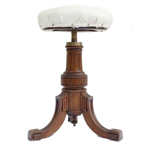 551F - Victorian carved wood upholstered Piano stool. The stool is fitted to the base by a solid brass fitt... 