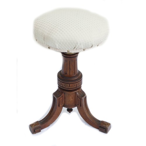 551F - Victorian carved wood upholstered Piano stool. The stool is fitted to the base by a solid brass fitt... 