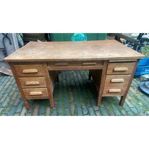 691 - Mid century oak 6 drawer desk.