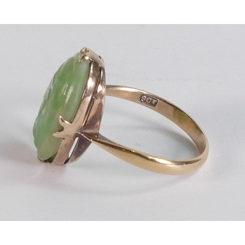 689 - 9ct gold ring set with carved Jade oval stone, ring size O/P, 4.2g.